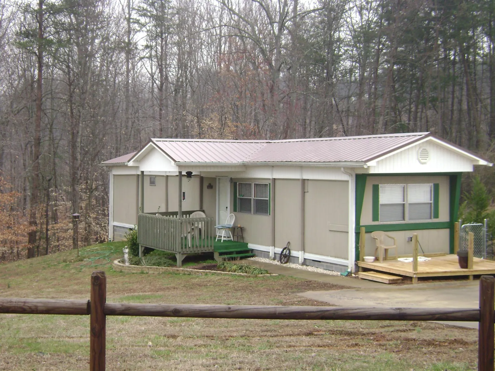 Mauve metal roof on a manufactured home with a new front deck in Hollywood